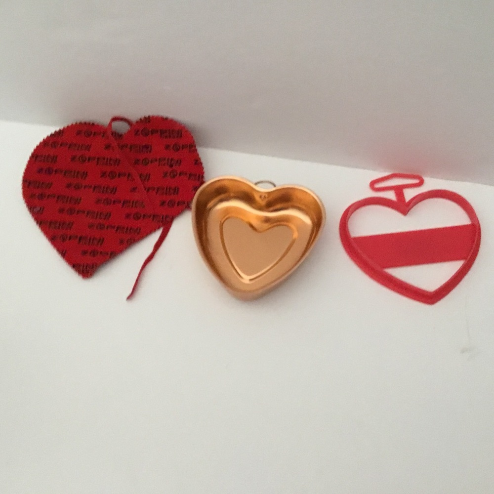 Cookie cutters. Lot of 2. Vintage. Heart shaped. One jewelry pouch.
